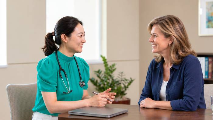 Dr. Claire Li meeting with a patient